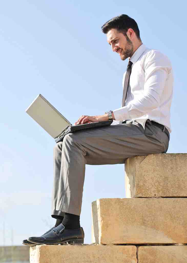 Man search on computer for services